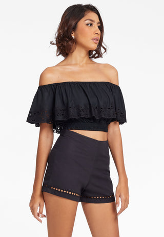 Off shoulder crop top with smocking design. Its ruffled layer has traditional Balinese lace embroidery handcrafted on it. This gorgeous top is in black colour.