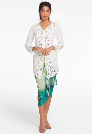 Full sleeved long traditional kebaya wear made with finest fabric. It has intricated handmade Balinese lace work designs and diamond hemline. Its colour is white.