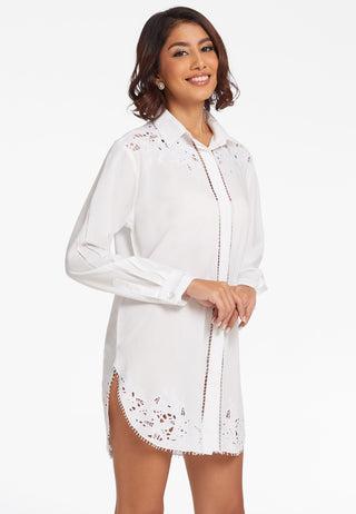  Shirt style summer dress in finest fabric and long length. It has curved hemline, handcrafted lace work, hidden buttons and is white in colour. 