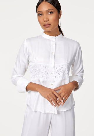 Full sleeved flared top with mandarin collar and shirt style design and curved hem line. Uluwatu lace’s signature handmade traditional Balinese lace work around middle of the top gives a classy look. 