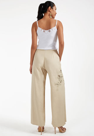 Studded with exquisite Balinese handmade lace embroidery on one side of the leg, ARIANA pant. These are loose flared pants made from linen. 