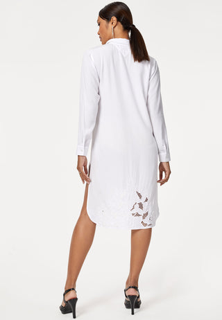 Full sleeved shirt dress with high low hemline decorated with traditional handmade Balinese lace embroidery work. The sleeves are cuffed, shell buttons add charm to it. 