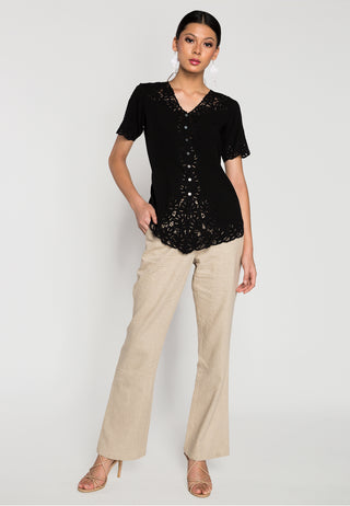 Flared formal linen pants from Uluwatu gives a sophisticated look and relaxed feel. Its colour is beige