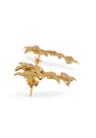 Stone studded ear climbers in gold plated silver with the sacred Asoka petal as design motif for a modern elegant look.