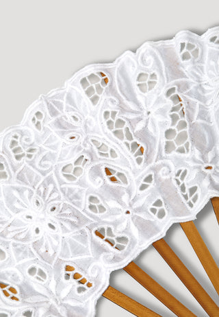 Handcrafted snow-white coloured hand fan made with Balinese lace work. It has long beaded tassels and wooden ribs.