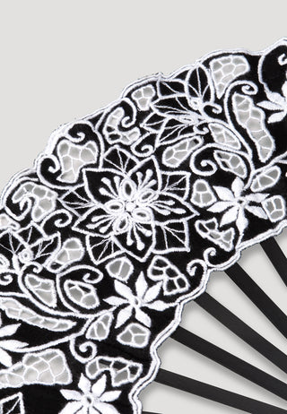 Stunning hand fan with black wooden ribs and black cotton leaf decorated with Balinese embroidery in white that complements well with long white beaded tassels. 