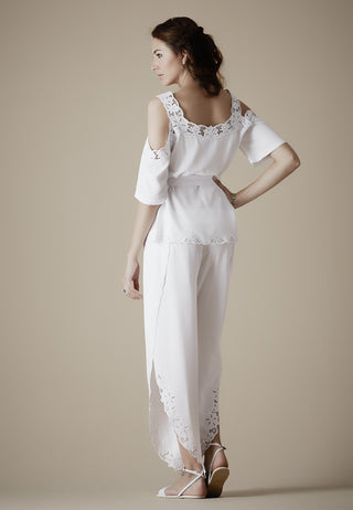 Loose fitted trousers styled with side slits and exquisite handmade Balinese lace work around the hem, just the gorgeous look. 