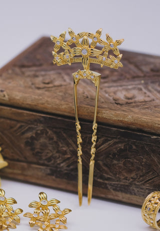 Tiny leaves of the sacred Asoka tree carved beautifully into a lovely hair piece studded with white stones in gold-plated sterling silver